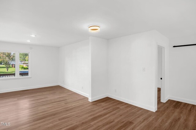 1907 Wilkins St, Burlington, NC 27217 - unfurnished room featuring wood finished floors and recessed lighting