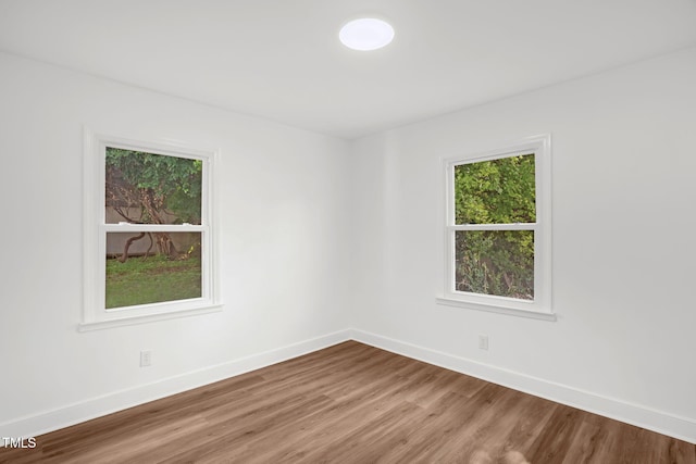 1907 Wilkins St, Burlington, NC 27217 - unfurnished room featuring wood finished floors and baseboards