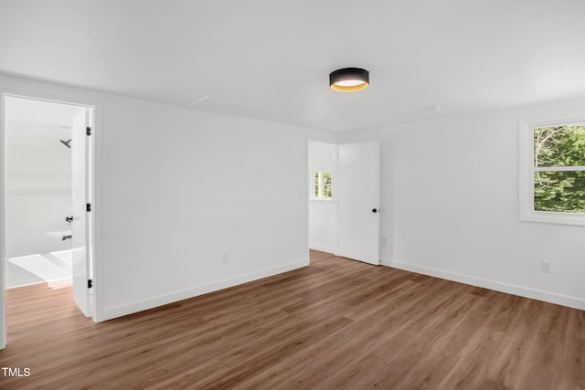 1907 Wilkins St, Burlington, NC 27217 - spare room featuring wood finished floors and baseboards