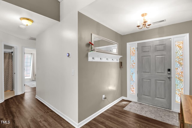 6001 Black Willow Dr, Greensboro, NC 27405 - foyer entrance with dark wood finished floors and a chandelier
