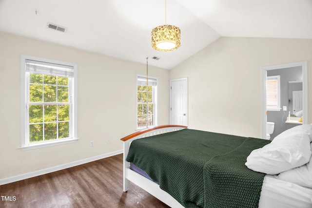 6001 Black Willow Dr, Greensboro, NC 27405 - bedroom featuring wood finished floors, lofted ceiling, and connected bathroom