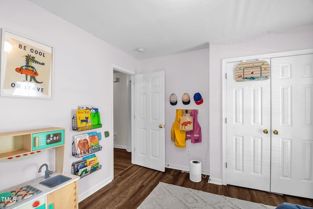 6001 Black Willow Dr, Greensboro, NC 27405 - recreation room with dark wood finished floors and baseboards