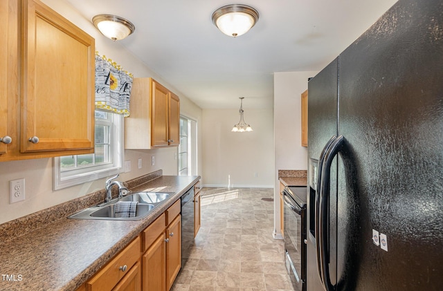 16 Emily Ct, Newton Grove, NC 28366 - kitchen featuring black appliances, stone finish flooring, dark countertops, decorative light fixtures, and a chandelier