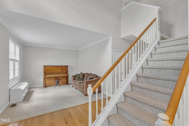 13201 Townfield Dr, Raleigh, NC 27614 - stairway featuring crown molding and wood finished floors