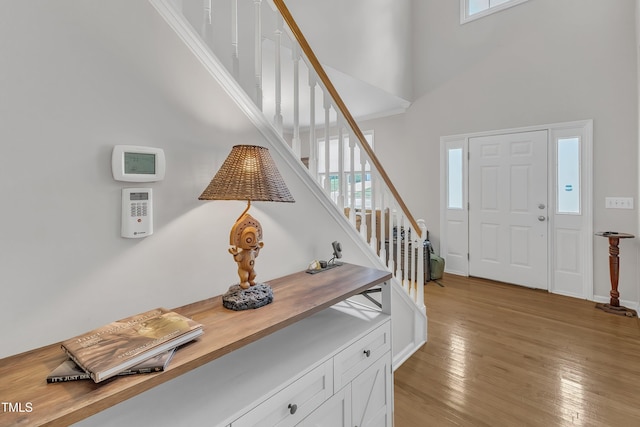 13201 Townfield Dr, Raleigh, NC 27614 - entrance foyer with a towering ceiling, stairs, and light wood-style flooring