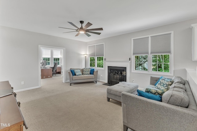 13201 Townfield Dr, Raleigh, NC 27614 - living room with a ceiling fan, healthy amount of natural light, a fireplace with flush hearth, and light colored carpet