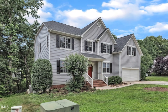 13201 Townfield Dr, Raleigh, NC 27614 - traditional home with driveway, a garage, a front lawn, and a shingled roof