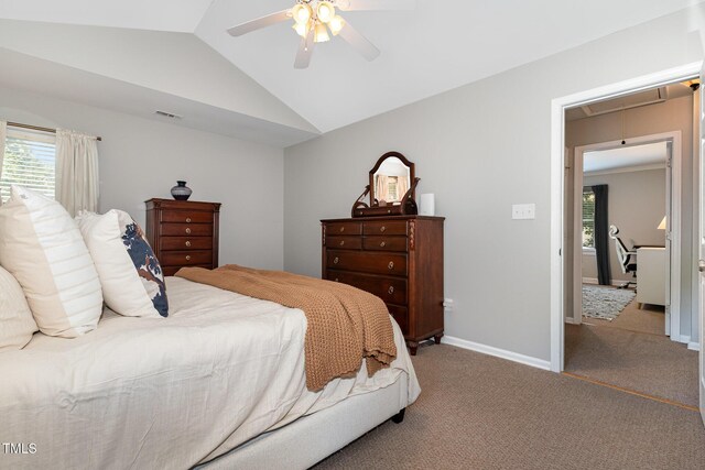 5609 Edgebury Rd, Raleigh, NC 27613 - bedroom featuring vaulted ceiling, attic access, multiple windows, carpet, and a ceiling fan