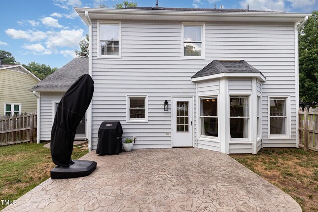 5609 Edgebury Rd, Raleigh, NC 27613 - back of property featuring a patio area and roof with shingles