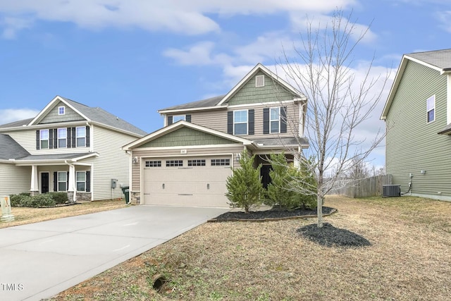 245 E Webber Ln, Clayton, NC 27527 - craftsman house with driveway, an attached garage, and stone siding