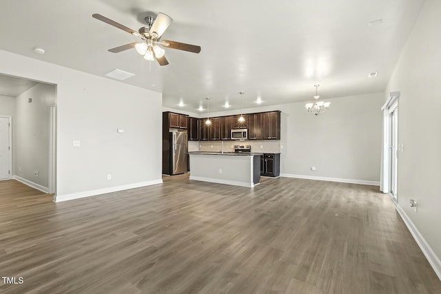 245 E Webber Ln, Clayton, NC 27527 - unfurnished living room with a chandelier, a ceiling fan, and wood finished floors