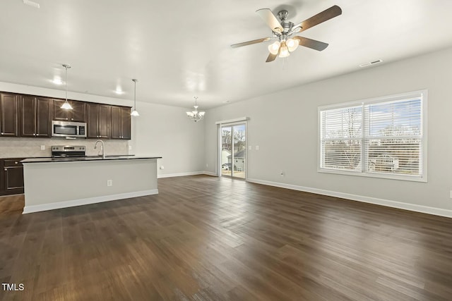 245 E Webber Ln, Clayton, NC 27527 - unfurnished living room with a chandelier, dark wood finished floors, and a ceiling fan