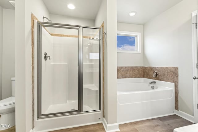 245 E Webber Ln, Clayton, NC 27527 - full bath with a shower stall, a bath, wood finished floors, and recessed lighting