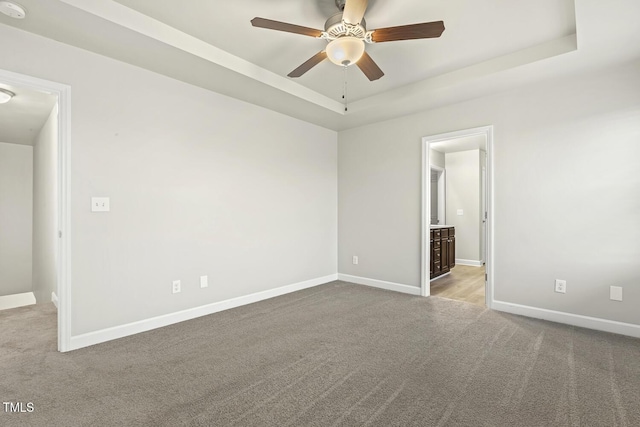 245 E Webber Ln, Clayton, NC 27527 - carpeted spare room featuring a ceiling fan and a raised ceiling