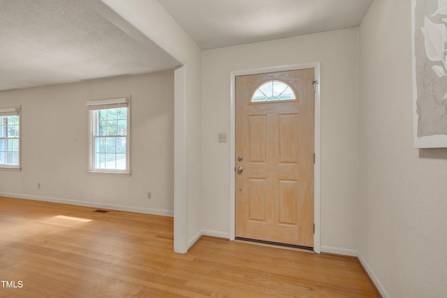 906 Cindy St, Cary, NC 27511 - entryway with light wood-style flooring and baseboards