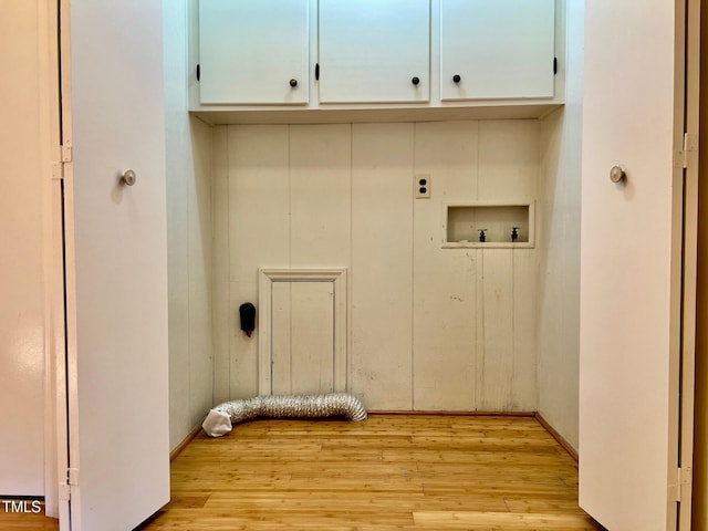 612 Williamsboro St, Oxford, NC 27565 - laundry area featuring hookup for an electric dryer, cabinet space, hookup for a washing machine, and light wood-type flooring