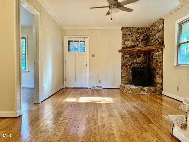 612 Williamsboro St, Oxford, NC 27565 - unfurnished living room with light wood-style floors, ornamental molding, and ceiling fan