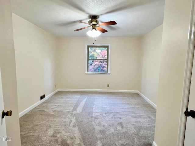 612 Williamsboro St, Oxford, NC 27565 - unfurnished room with carpet floors, ceiling fan, and a textured ceiling