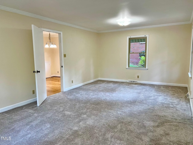 612 Williamsboro St, Oxford, NC 27565 - carpeted spare room featuring crown molding and a chandelier