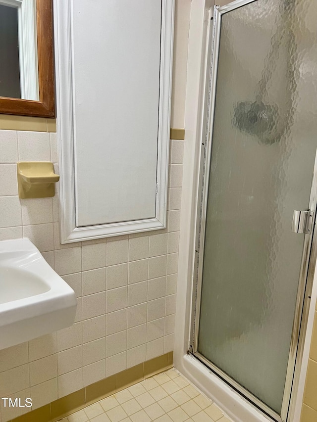 612 Williamsboro St, Oxford, NC 27565 - full bath with tile walls, a stall shower, and tile patterned flooring