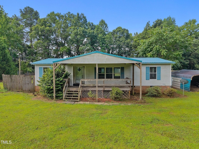112 Elsie Marie Dr, Youngsville, NC 27596 - view of front of house featuring a porch, a detached carport, and a metal roof