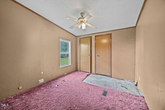 112 Elsie Marie Dr, Youngsville, NC 27596 - unfurnished bedroom with crown molding, a textured ceiling, carpet, multiple closets, and ceiling fan