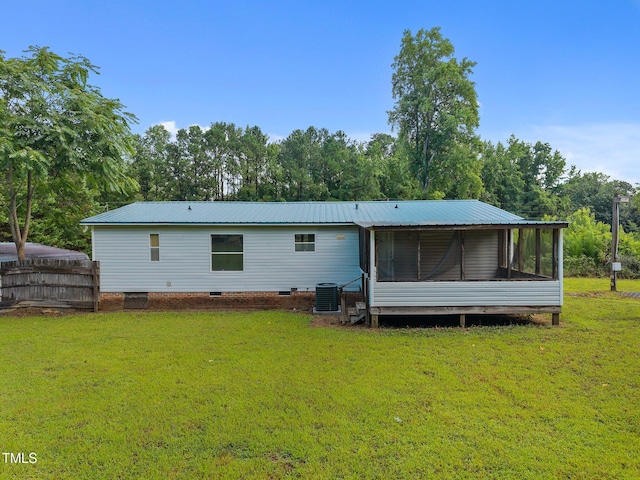 112 Elsie Marie Dr, Youngsville, NC 27596 - back of house with a sunroom and a metal roof