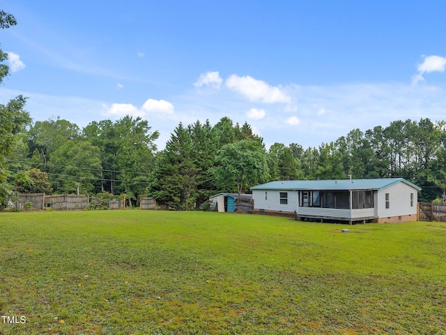 112 Elsie Marie Dr, Youngsville, NC 27596 - view of yard featuring a sunroom and a storage shed