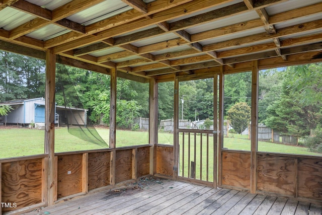 112 Elsie Marie Dr, Youngsville, NC 27596 - unfurnished sunroom featuring view of scattered trees and plenty of natural light