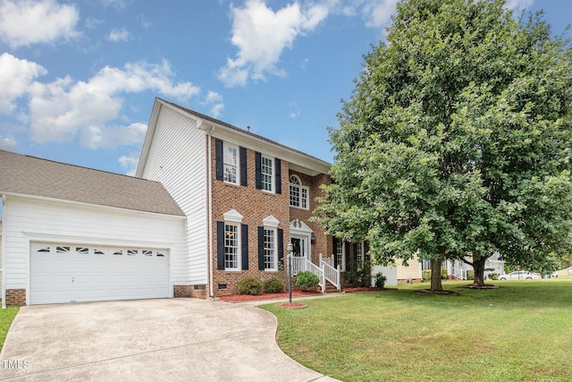 801 Falling Wind Ct, Raleigh, NC 27610 - colonial house with driveway, a front lawn, a garage, and brick siding