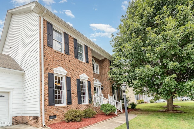 801 Falling Wind Ct, Raleigh, NC 27610 - view of front of home with a front yard, brick siding, and crawl space