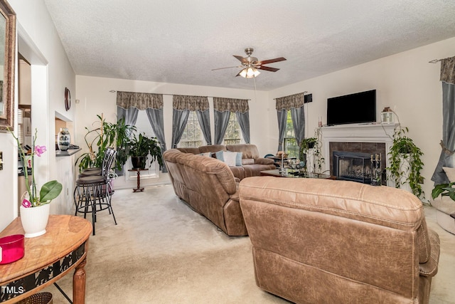 801 Falling Wind Ct, Raleigh, NC 27610 - living room featuring light carpet, ceiling fan, a textured ceiling, and a fireplace