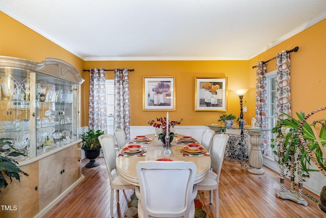 801 Falling Wind Ct, Raleigh, NC 27610 - dining room with wood-type flooring and crown molding