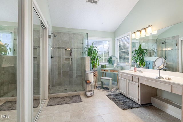 801 Falling Wind Ct, Raleigh, NC 27610 - full bath featuring lofted ceiling, a stall shower, vanity, and tile patterned floors