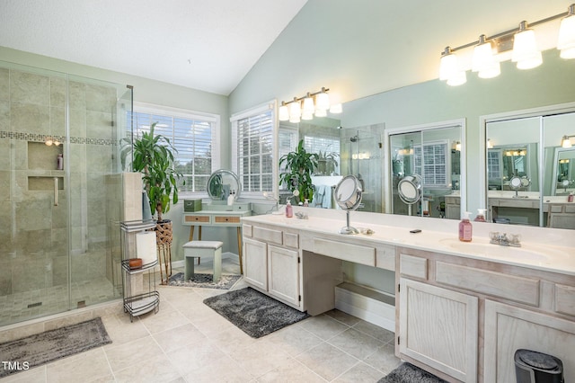 801 Falling Wind Ct, Raleigh, NC 27610 - bathroom featuring a stall shower, vaulted ceiling, vanity, and tile patterned floors