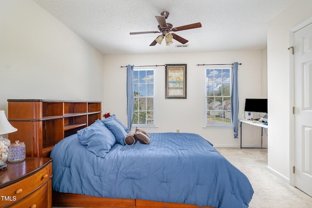 801 Falling Wind Ct, Raleigh, NC 27610 - bedroom with carpet floors, multiple windows, a textured ceiling, and ceiling fan