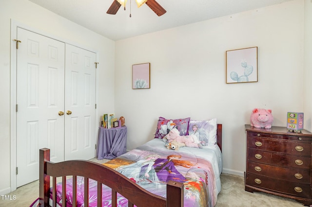 801 Falling Wind Ct, Raleigh, NC 27610 - bedroom with light colored carpet, a closet, and a ceiling fan