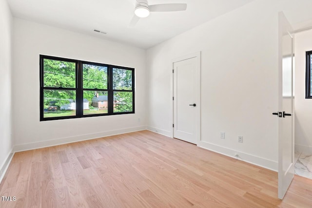 2205 Tampa Ave, Durham, NC 27705 - spare room with light wood-type flooring and ceiling fan