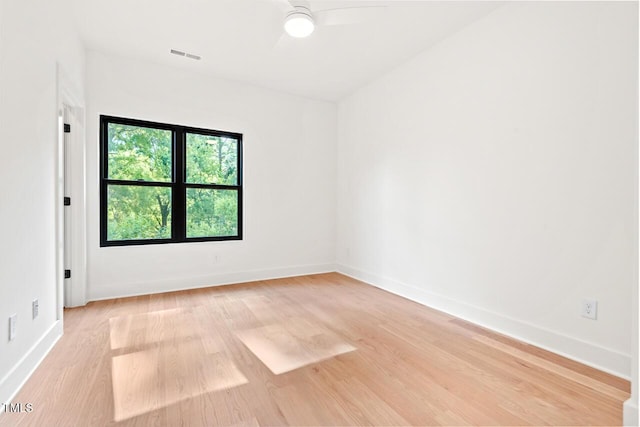 2205 Tampa Ave, Durham, NC 27705 - unfurnished room with light wood finished floors and ceiling fan