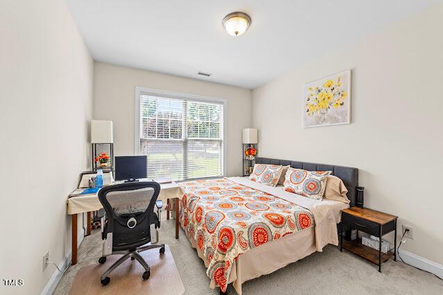 4007 Strendal Dr, Cary, NC 27519 - carpeted bedroom with a desk and baseboards