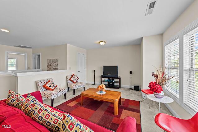 4007 Strendal Dr, Cary, NC 27519 - carpeted living room with healthy amount of natural light