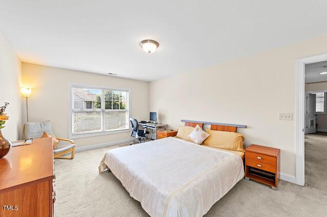 4007 Strendal Dr, Cary, NC 27519 - bedroom with light colored carpet and baseboards