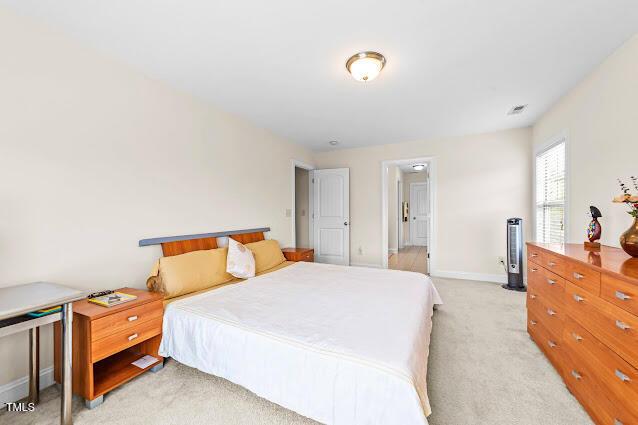 4007 Strendal Dr, Cary, NC 27519 - bedroom with light colored carpet and baseboards