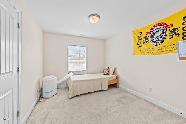 4007 Strendal Dr, Cary, NC 27519 - carpeted bedroom featuring baseboards