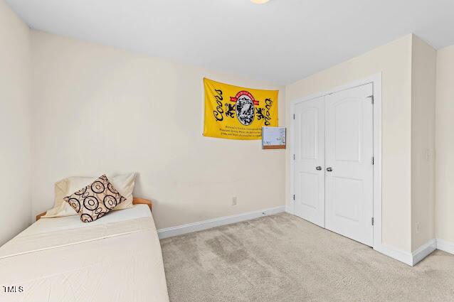 4007 Strendal Dr, Cary, NC 27519 - unfurnished bedroom featuring carpet floors and a closet