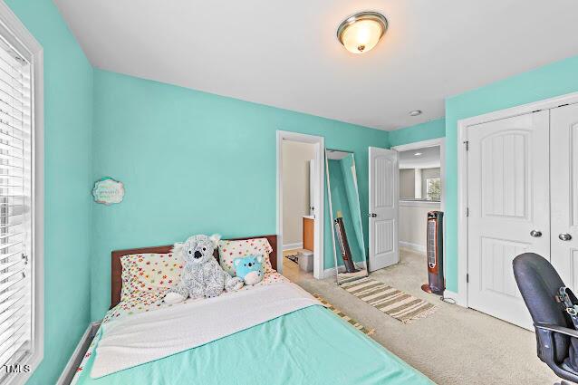 4007 Strendal Dr, Cary, NC 27519 - carpeted bedroom with a closet and baseboards