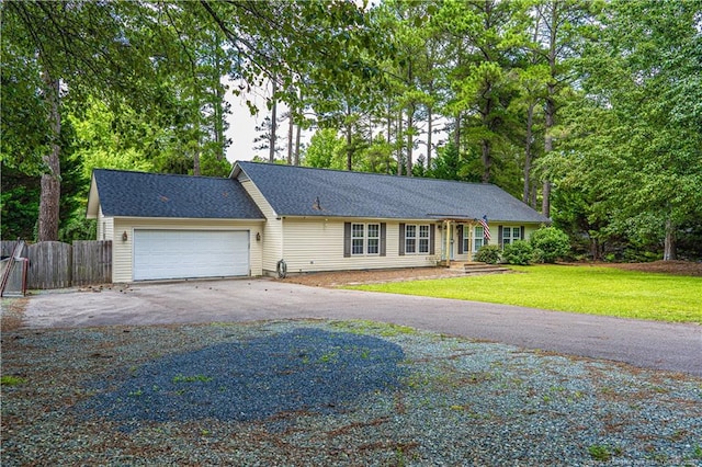 1360 Rays Bridge Rd, Whispering Pines, NC 28327 - ranch-style home with driveway and an attached garage