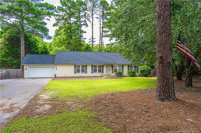 1360 Rays Bridge Rd, Whispering Pines, NC 28327 - ranch-style house with driveway and an attached garage