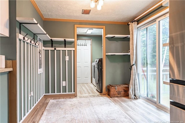1360 Rays Bridge Rd, Whispering Pines, NC 28327 - interior space with washing machine and dryer, wood finished floors, a textured ceiling, and crown molding