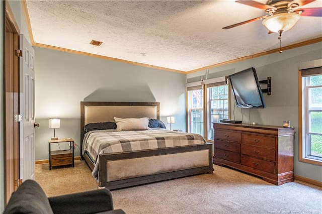 1360 Rays Bridge Rd, Whispering Pines, NC 28327 - carpeted bedroom featuring crown molding, ceiling fan, and a textured ceiling